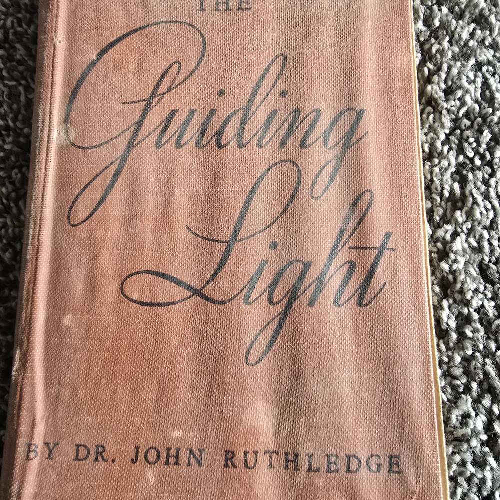 The Guiding Light by Dr. John Ruthledge - Brown Cover